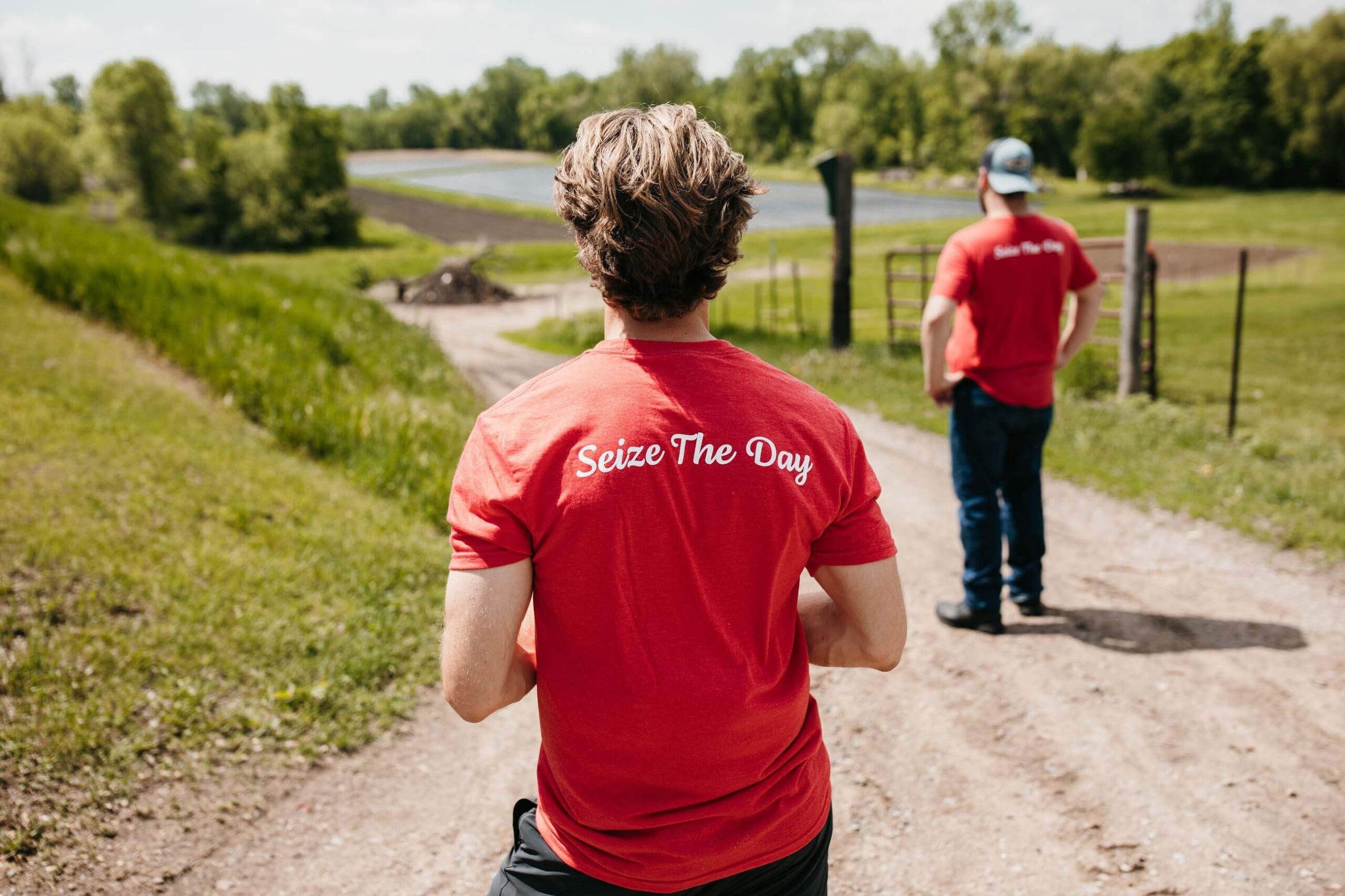 Man wearing red t-shirt that says "Seize the Day"